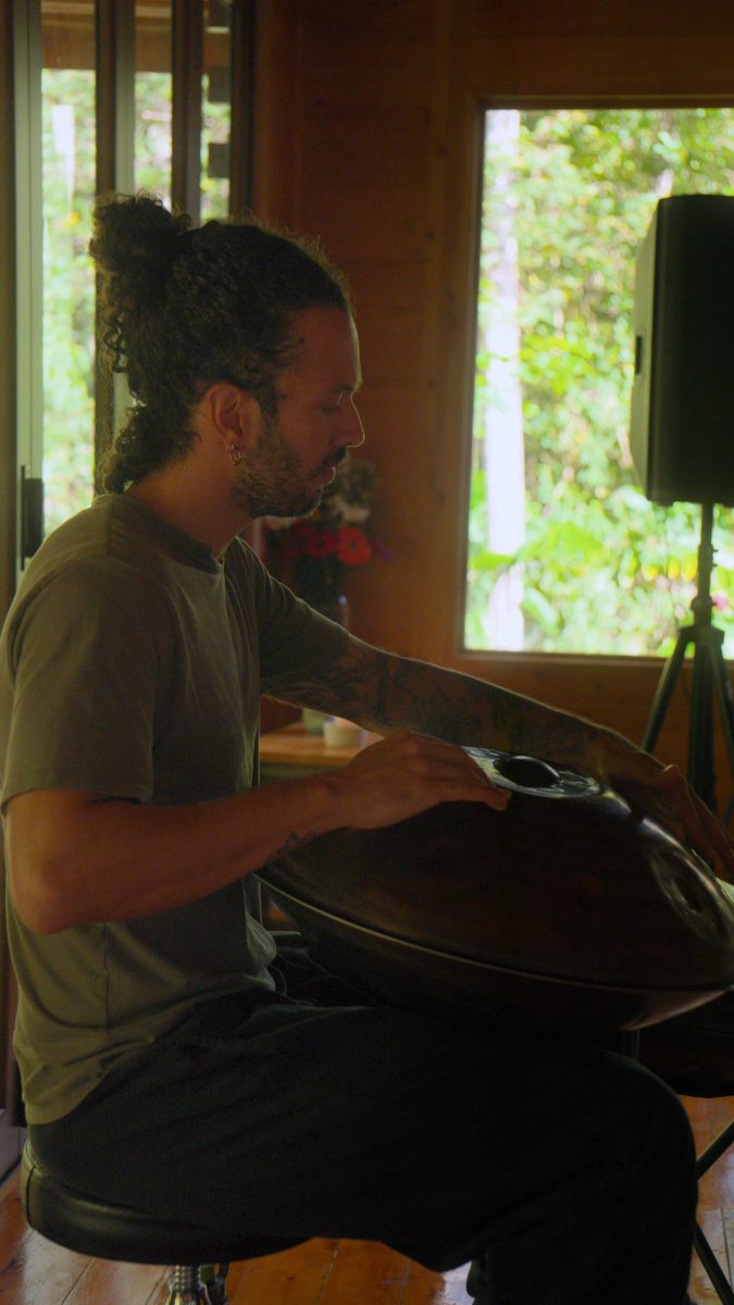 A musician playing handpan